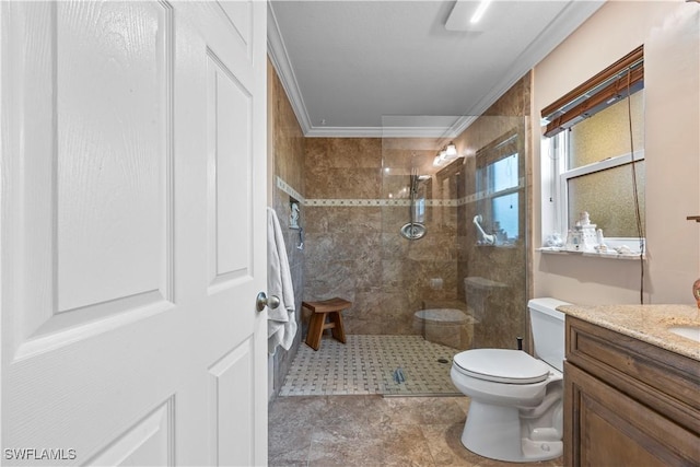 bathroom featuring ornamental molding, toilet, a walk in shower, and vanity
