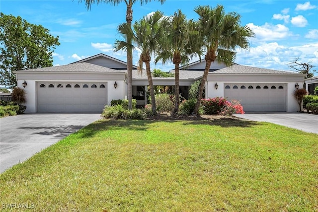 16591 Waters Edge Ct, Fort Myers, FL 33908 - ranch-style home with an attached garage, stucco siding, driveway, and a front yard