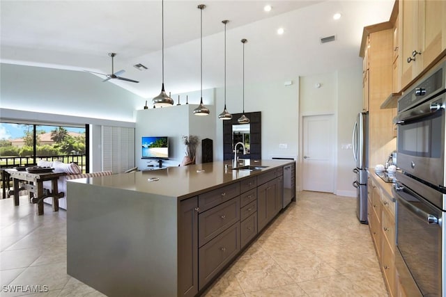 16591 Waters Edge Ct, Fort Myers, FL 33908 - kitchen with a sink, a large island, a ceiling fan, light tile patterned floors, and stainless steel appliances