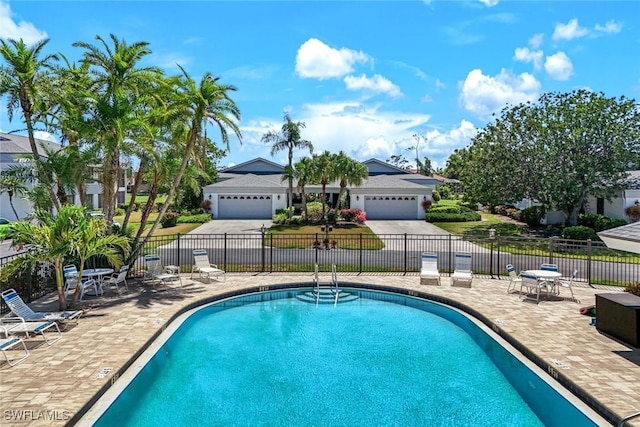16591 Waters Edge Ct, Fort Myers, FL 33908 - community pool with fence and a patio area