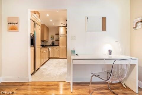 interior space with light wood-style floors, recessed lighting, and baseboards