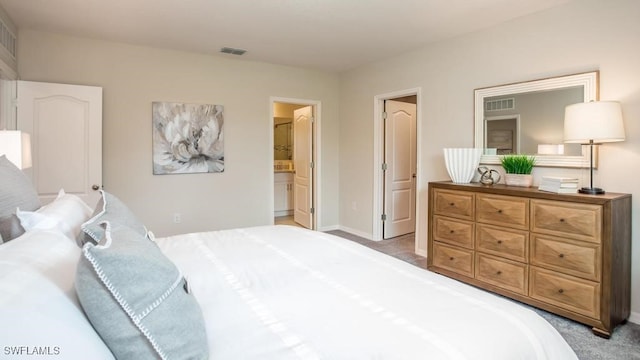 bedroom with visible vents, light carpet, and baseboards