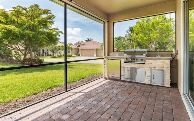 unfurnished sunroom with area for grilling