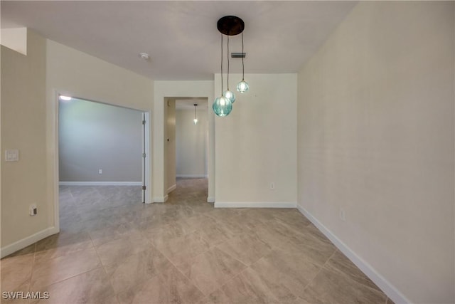 unfurnished dining area featuring baseboards