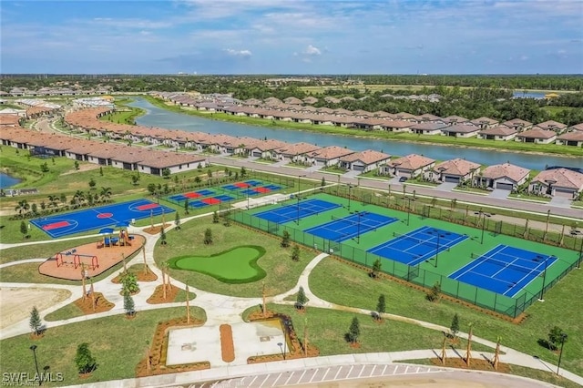 drone / aerial view featuring a water view and a residential view