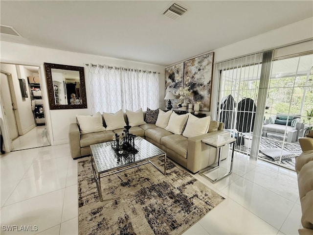 2084 46th St SW, Naples, FL 34116 - living room with light tile patterned floors