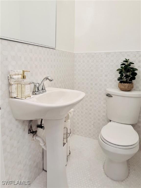 2084 46th St SW, Naples, FL 34116 - half bath with wainscoting and toilet