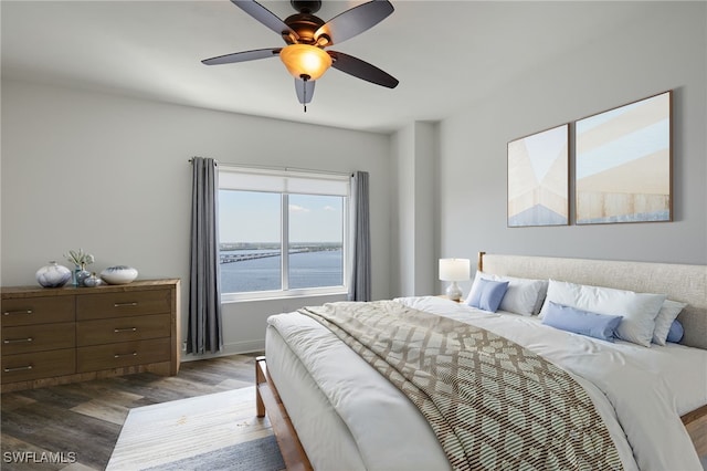 2743 1st St Unit 2001, Fort Myers, FL 33916 - bedroom featuring baseboards, ceiling fan, and wood finished floors