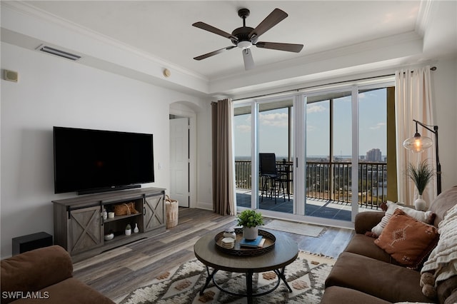 2743 1st St Unit 2001, Fort Myers, FL 33916 - living area featuring crown molding, a ceiling fan, visible vents, and wood finished floors