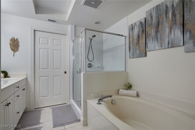 2743 1st St Unit 2001, Fort Myers, FL 33916 - full bath featuring visible vents, a garden tub, vanity, tile patterned floors, and a stall shower