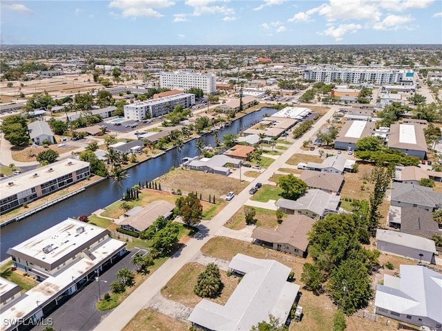 bird's eye view featuring a water view and a residential view