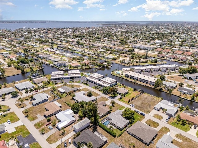 aerial view with a water view and a residential view