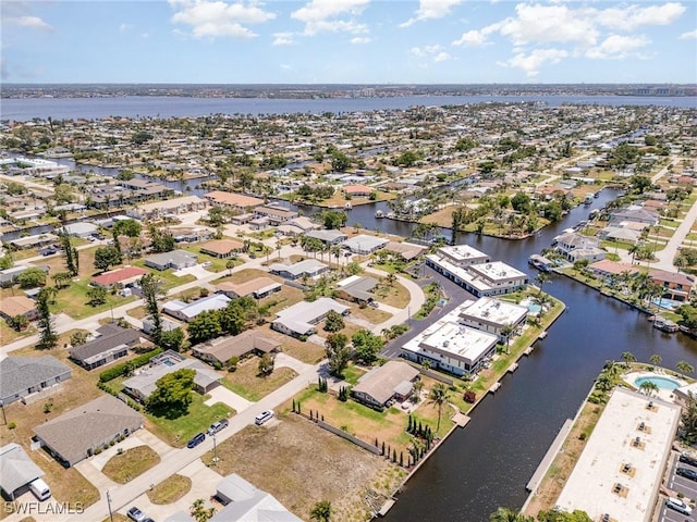 aerial view featuring a water view and a residential view