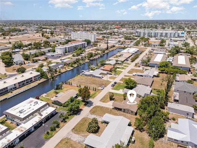 aerial view featuring a water view and a residential view