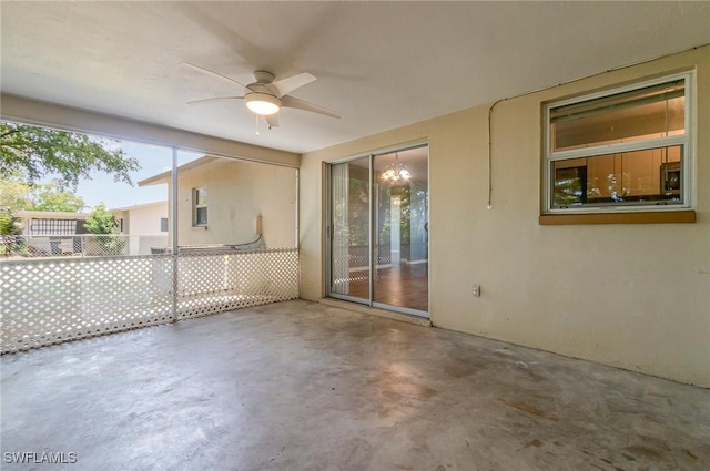 view of patio / terrace with a ceiling fan and fence