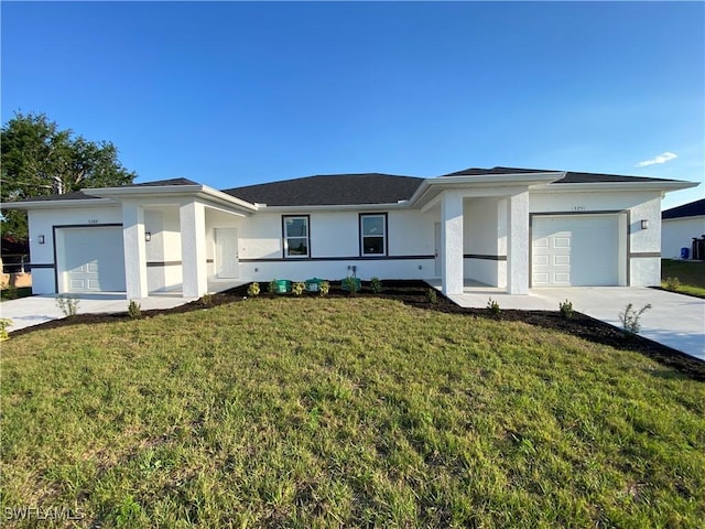 5249-5251 Centennial Blvd, Lehigh Acres, FL 33971 - view of front of property featuring concrete driveway, an attached garage, stucco siding, and a front lawn