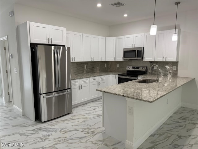 5249-5251 Centennial Blvd, Lehigh Acres, FL 33971 - kitchen with stainless steel appliances, a sink, light marble finish flooring, baseboards, and light stone counters