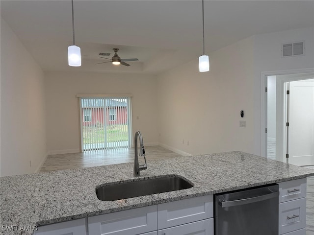 5249-5251 Centennial Blvd, Lehigh Acres, FL 33971 - kitchen featuring stainless steel dishwasher, a sink, ceiling fan, open floor plan, and light stone countertops