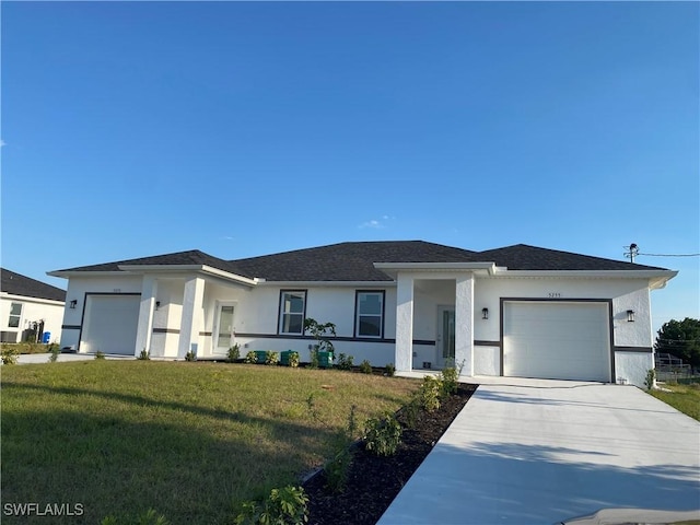 5249-5251 Centennial Blvd, Lehigh Acres, FL 33971 - view of front of property with a garage, stucco siding, concrete driveway, a front lawn, and roof with shingles