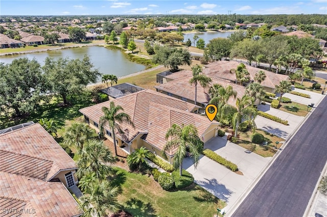 bird's eye view featuring a water view and a residential view