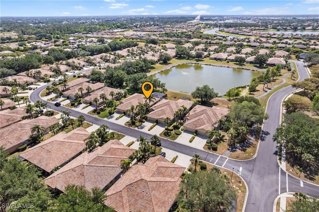 birds eye view of property featuring a residential view and a water view