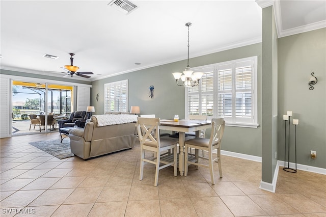 dining space featuring crown molding, light tile patterned flooring, and visible vents