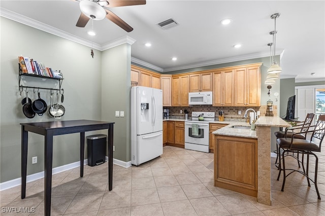 kitchen featuring visible vents, crown molding, a sink, a peninsula, and white appliances