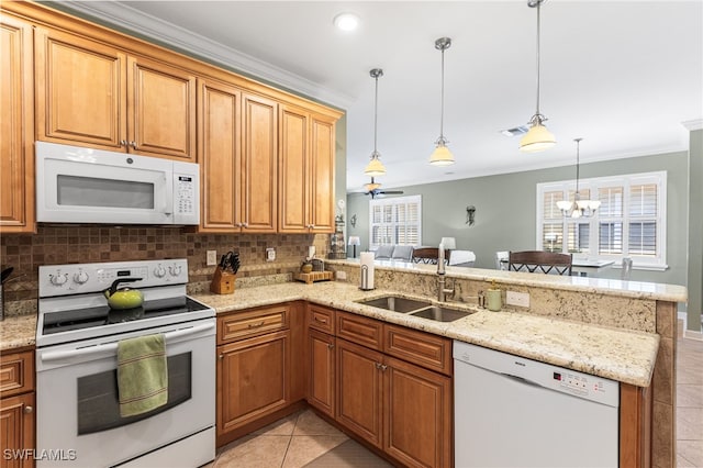 kitchen featuring a sink, white appliances, a peninsula, decorative backsplash, and light tile patterned floors