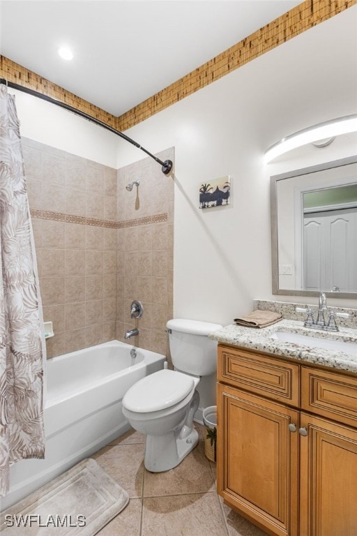 bathroom featuring tile patterned flooring, toilet, shower / tub combo, and vanity