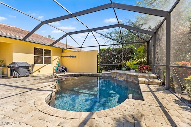 pool featuring grilling area, a patio area, and glass enclosure