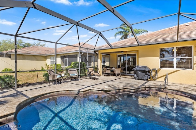 outdoor pool featuring a lanai, a patio, and area for grilling