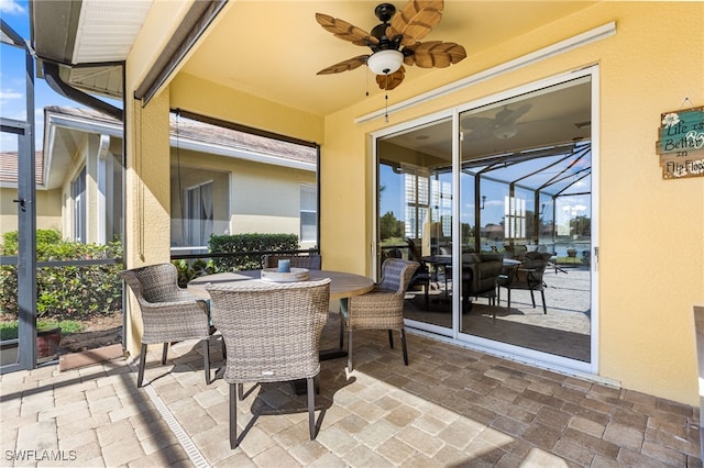 view of patio featuring a ceiling fan and outdoor dining space