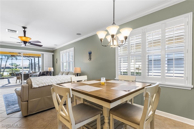 dining space featuring crown molding, tile patterned floors, ceiling fan with notable chandelier, baseboards, and visible vents