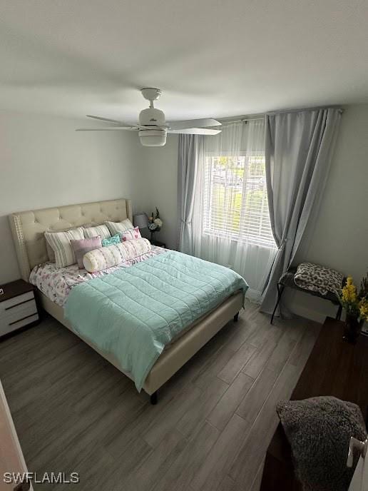 bedroom with ceiling fan and wood finished floors