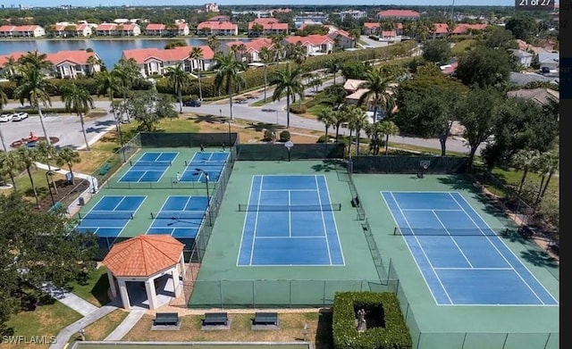 drone / aerial view with a residential view and a water view