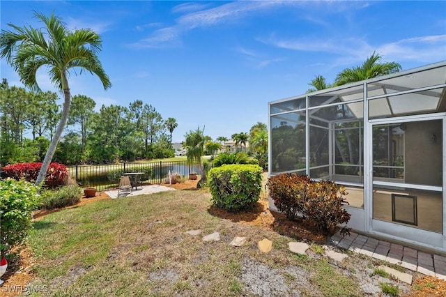 23125 Marsh Landing Blvd, Estero, FL 33928 - view of yard with a water view, fence, a lanai, and a patio area