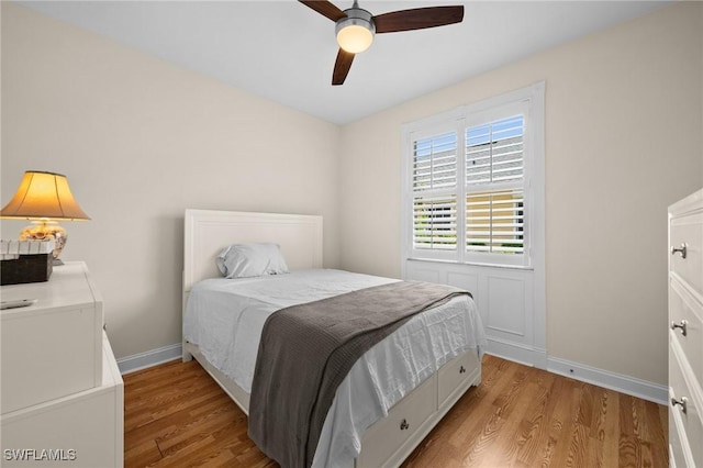 23125 Marsh Landing Blvd, Estero, FL 33928 - bedroom featuring baseboards, a ceiling fan, and light wood finished floors