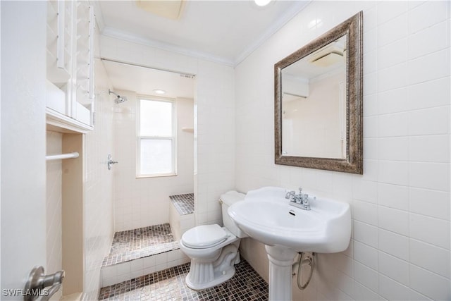 bathroom with tile patterned flooring, ornamental molding, toilet, and a shower stall