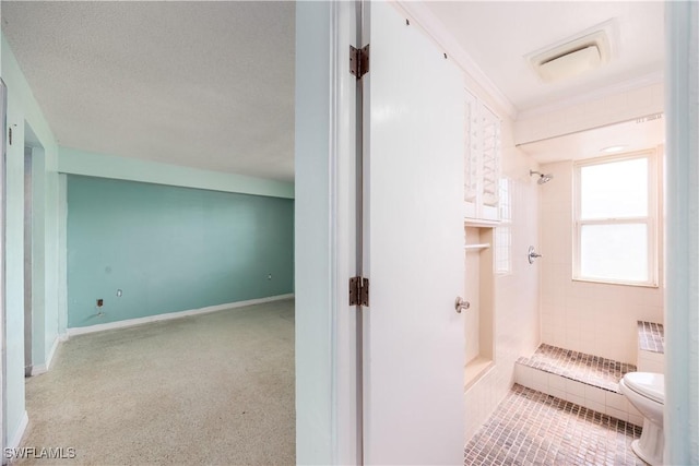 bathroom featuring visible vents, toilet, and a shower stall