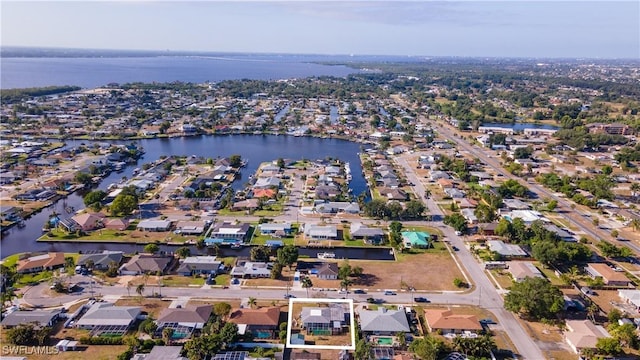 aerial view featuring a water view and a residential view