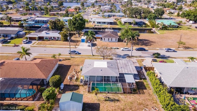 birds eye view of property featuring a residential view and a water view
