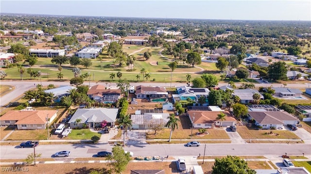 drone / aerial view featuring a residential view and view of golf course