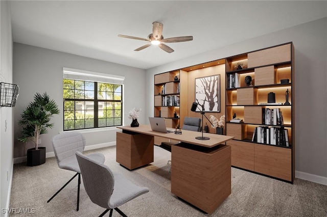 office with carpet floors, ceiling fan, and baseboards