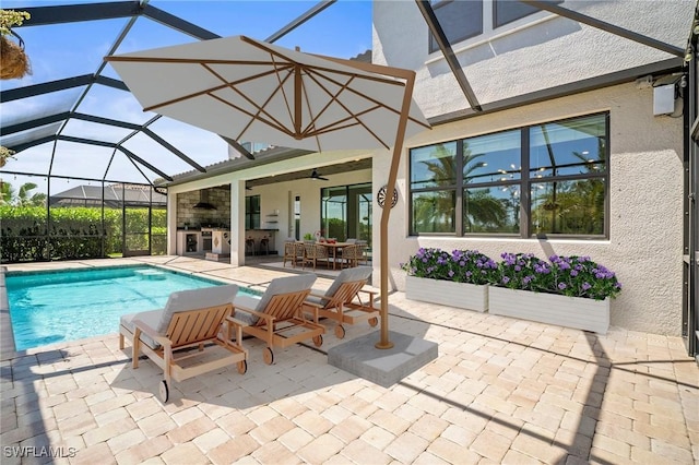 pool with glass enclosure, a patio, ceiling fan, and outdoor dining area