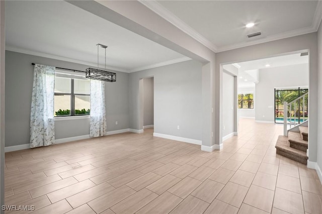 interior space featuring baseboards, ornamental molding, and a chandelier