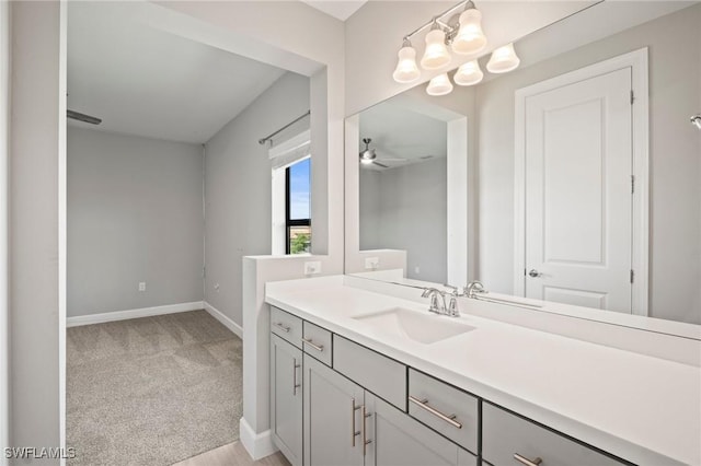 bathroom featuring baseboards and vanity