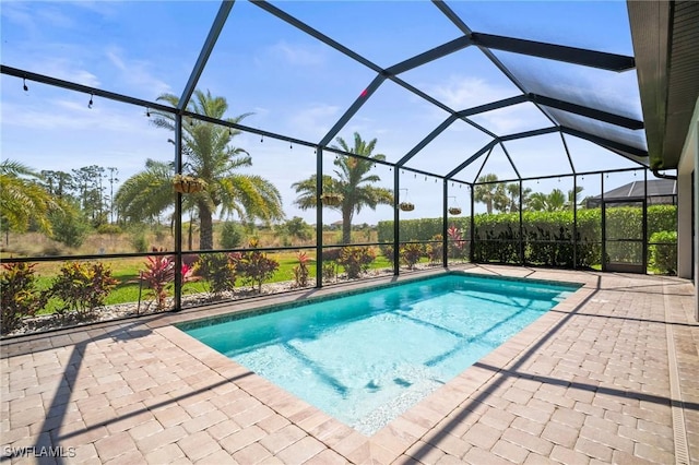 pool with a patio and a lanai