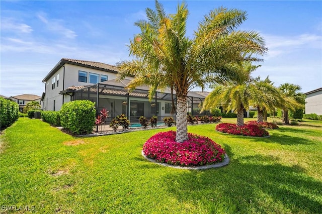 view of yard featuring a lanai