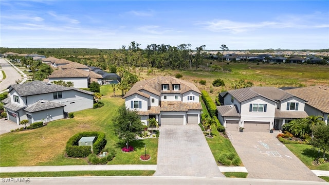 birds eye view of property with a residential view