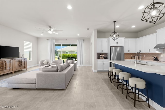 3419 Pilot Cir, Naples, FL 34120 - living area featuring recessed lighting, ceiling fan, and baseboards